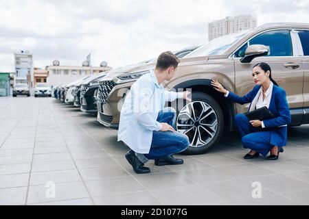 Cutomer checking car tires Stock Photo