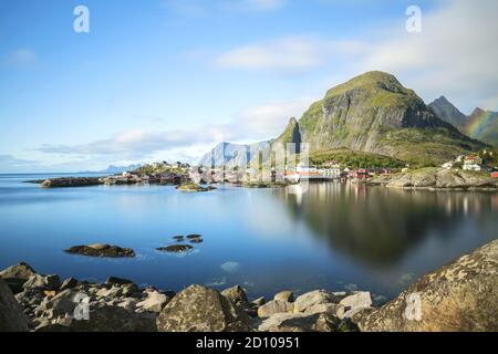 Panorama of A - village, Moskenes, on the Lofoten in northern Norway. Norwegian fishing village, with the typical rorbu houses. Mountain In Background Stock Photo