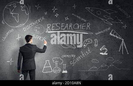 Man draw on chalkboard Stock Photo