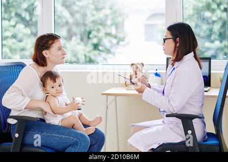 Giving advice to mother Stock Photo