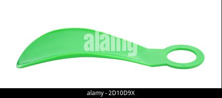 Green plastic shoe spoon isolated on white. Stock Photo