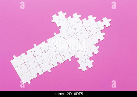 White details of puzzle on pink background Concept success of business - Image Stock Photo