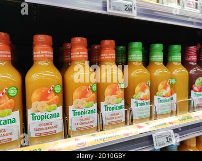 La Rochelle, France - October 3, 2020:Tropicana orange juice bottles on shelves in a french supermarket. In the U.S, the major orange juice brand is T Stock Photo