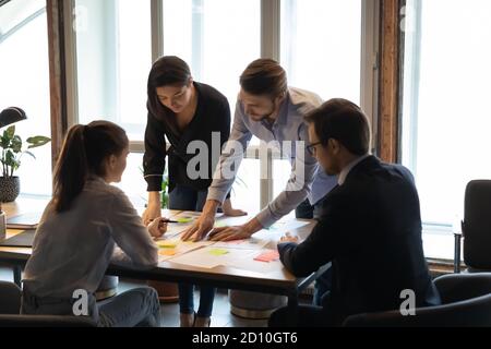 Focused young multiracial manager developing marketing strategy. Stock Photo