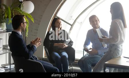 Skilled leader mentor coaching employees, leading workshop in office. Stock Photo