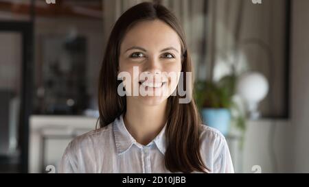 Close up portrait of young european ambitions female employee, Stock Photo