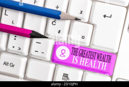 Conceptual hand writing showing The Greatest Wealth Is Health. Concept meaning Many sacrifice their money just to be healthy Colored keyboard key with Stock Photo