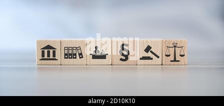 Concept of law and justice with icons on wooden cubes Stock Photo