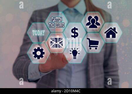 Writing note showing Flatten The Curve. Business concept for raising an awareness on slowing the rate of the infectious disease Grids and different ic Stock Photo