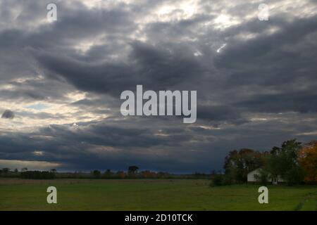 Autumn Rainstorm coming in over farmland Stock Photo