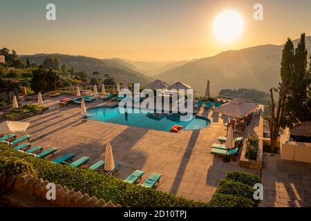 Traveling Lebanon. Pool with Refreshing Water in the Mild Sunset Light. Beautiful Resort in the Heart of the Mountains. Stock Photo