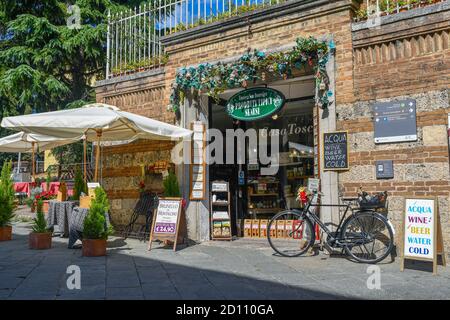 Exterior of the Enoteca San Domenico food and wine store selling typical Tuscan products in the historic centre of Siena, Tuscany, Italy Stock Photo