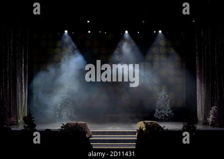 An empty stage of the theater, lit by spotlights and smoke before the performance Stock Photo