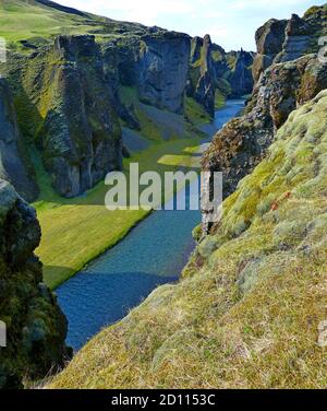 Fjadrargljufur Canyon and Fjadra River in Iceland  Wonderful icelandic landscape. Green mossy cliffs.Picturesque gorge has steep walls with green moss Stock Photo