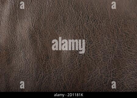 Brown leather surface as background. Macro shot. Leather surface texture. Top view. Stock Photo