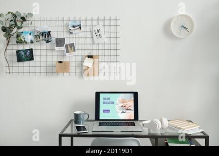Workplace of freelancer or home office manager consisting of variety of supplies Stock Photo