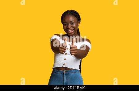 I Like It. Smiling African American Lady Showing Thumbs Up At Camera Stock Photo