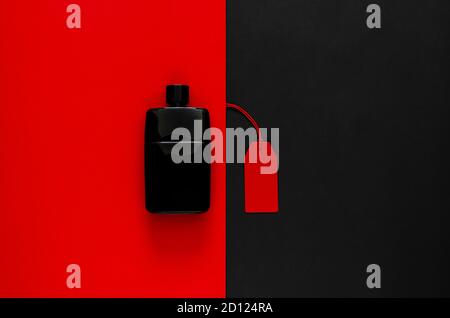 Red price tags with discount merchandise on red and black background. Black Friday concept. Stock Photo