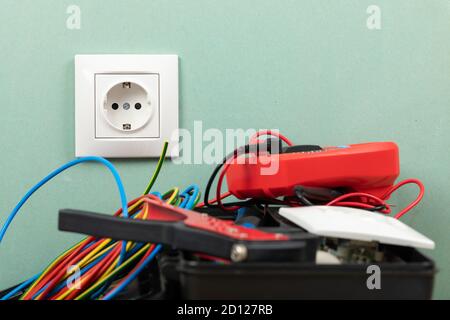 Tools for electrician needs: multimeter, voltage testers, wire strippers, pliers, Stock Photo