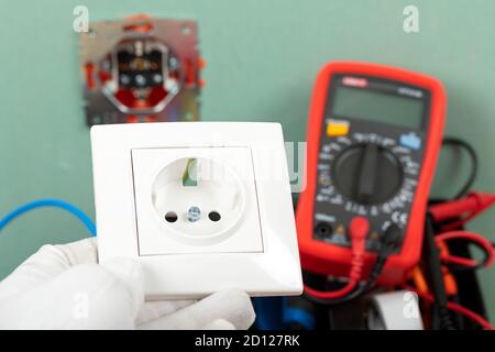Tools for electrician needs: multimeter, voltage testers, wire strippers, pliers, Stock Photo