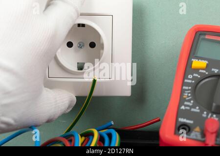 Tools for electrician needs: multimeter, voltage testers, wire strippers, pliers, Stock Photo