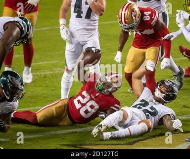 Seattle Seahawks corner back Marcus Trufant (23) reaches out for a low  tackle attempt of Philadelphia Eagles running back Correll Buckhalter (28)  during first quarter play at Philadelphia's Lincoln Field December 2