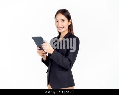 Portrait of young beauty Asian Businesswoman in black suit holding and using tablet and looking at camera isolated on white background. Beautiful smil Stock Photo
