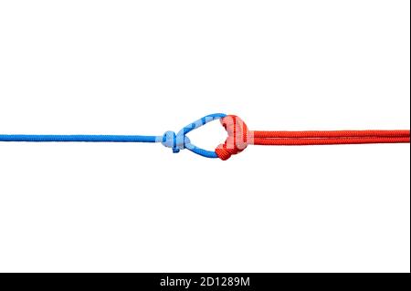 Two red and blue cords are connected . Knot on a cord isolated on a white background . Stock Photo