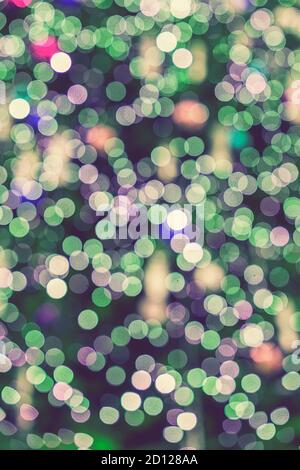 Abstract green bokeh background. Defocused abstract green background. Blurred holiday bokeh. vertical photo Stock Photo