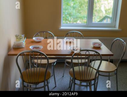 school kitchen canteen, set tables, canteen equipment, catering establishment, tables and chairs Stock Photo
