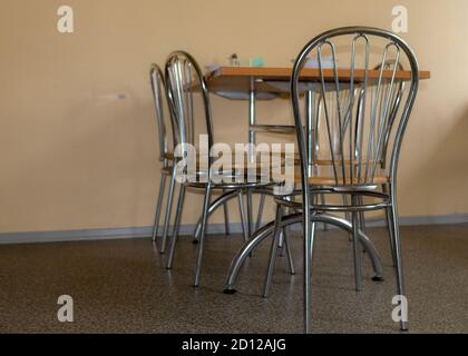 school kitchen canteen, metal table and chair legs, canteen equipment, catering establishment, tables and chairs Stock Photo