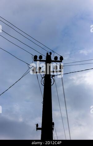 Electric pole and wires against the sky Stock Photo