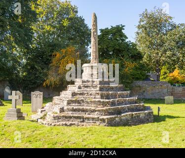 Medieval churchyard standing cross and ancient gravestones, Chew Magna, Somerset, England, UK Stock Photo