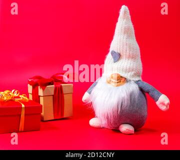 Festive scarf on a red background as a symbol of the new year. Stock Photo