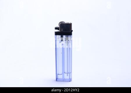 gas lighter with transparent blue container. a tool to burn against a white background Stock Photo