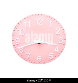 Clock with pink dial and white numbers and arrows on isolated background Stock Photo