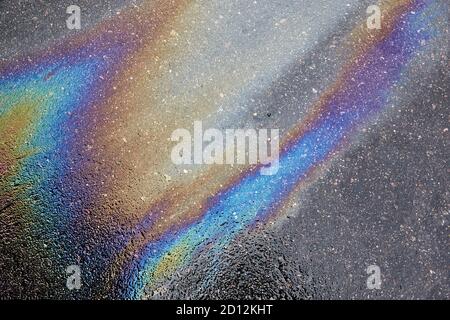 Oil spill on asphalt road background or texture Stock Photo