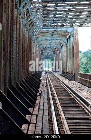 Old railway bridge – active. Bridge in the village of Czernica - near Wroclaw. The bridge was rebuilt in 1935, rebuilt from war damage in 1959. Stock Photo