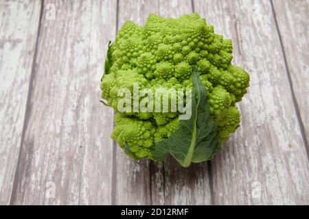 Romanesco (Brassica oleracea), on a wooden work top, England, UK, GB, Stock Photo