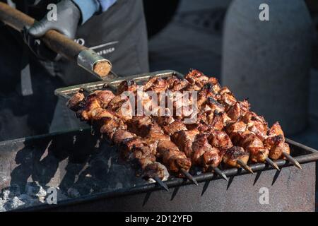 Shish kebab of meat skewered on a grill close-up outdoors Stock Photo -  Alamy