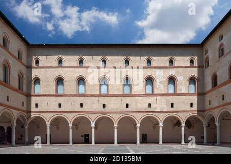 View from internal court to walls and arcades of ancient medieval fortress Rocchetta inside the Sforza castle. Milan, ITALY - July 7, 2020. Stock Photo