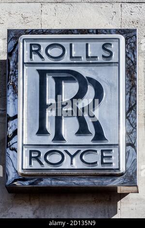 London, UK, April 1, 2012 : Rolls Royce sign advertising logo at their car showroom dealership a business selling luxury cars and SUVs stock photo ima Stock Photo