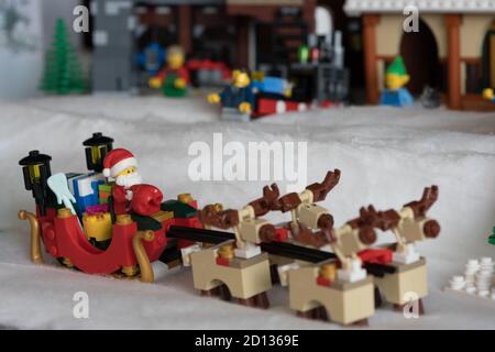 Lego Santa in his Reindeer Sleigh sets out on Christmas Eve Stock Photo