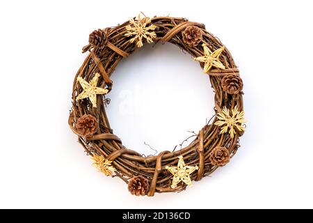 Rustic wooden Christmas wreath with pine cones isolated on whote background. Natural Christmas decoration Stock Photo