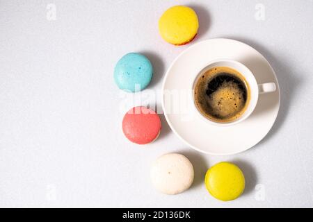 Coffee and macaroons on a white background. View from above. Stock Photo