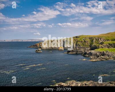 Coastal cliffs and scenery at Fethaland on the north coast of Northmavine, Shetland, Scotland, UK - taken on a calm, sunny day in summer Stock Photo