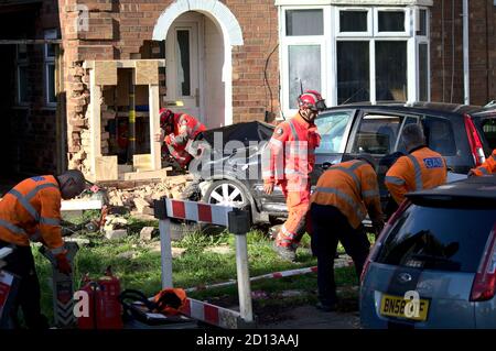 Technical Rescue team from WMFS on the scene after a 15-year old crashed a car into a house in Kingstanding, Birmingham and ruptured a gas main Stock Photo