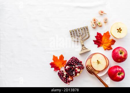 Jewish cuisine for rosh hashana holiday - apple honey and pomegranate, top view