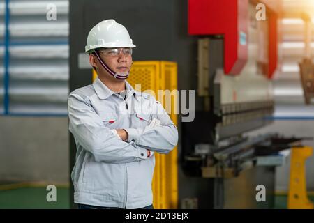 The worker in the uniform machine shop Stock Photo