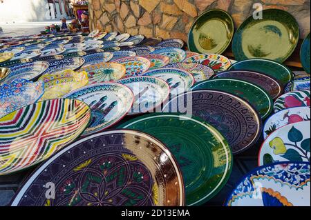 Uzbek souvenirs in Bukhara. Decorated plates Stock Photo